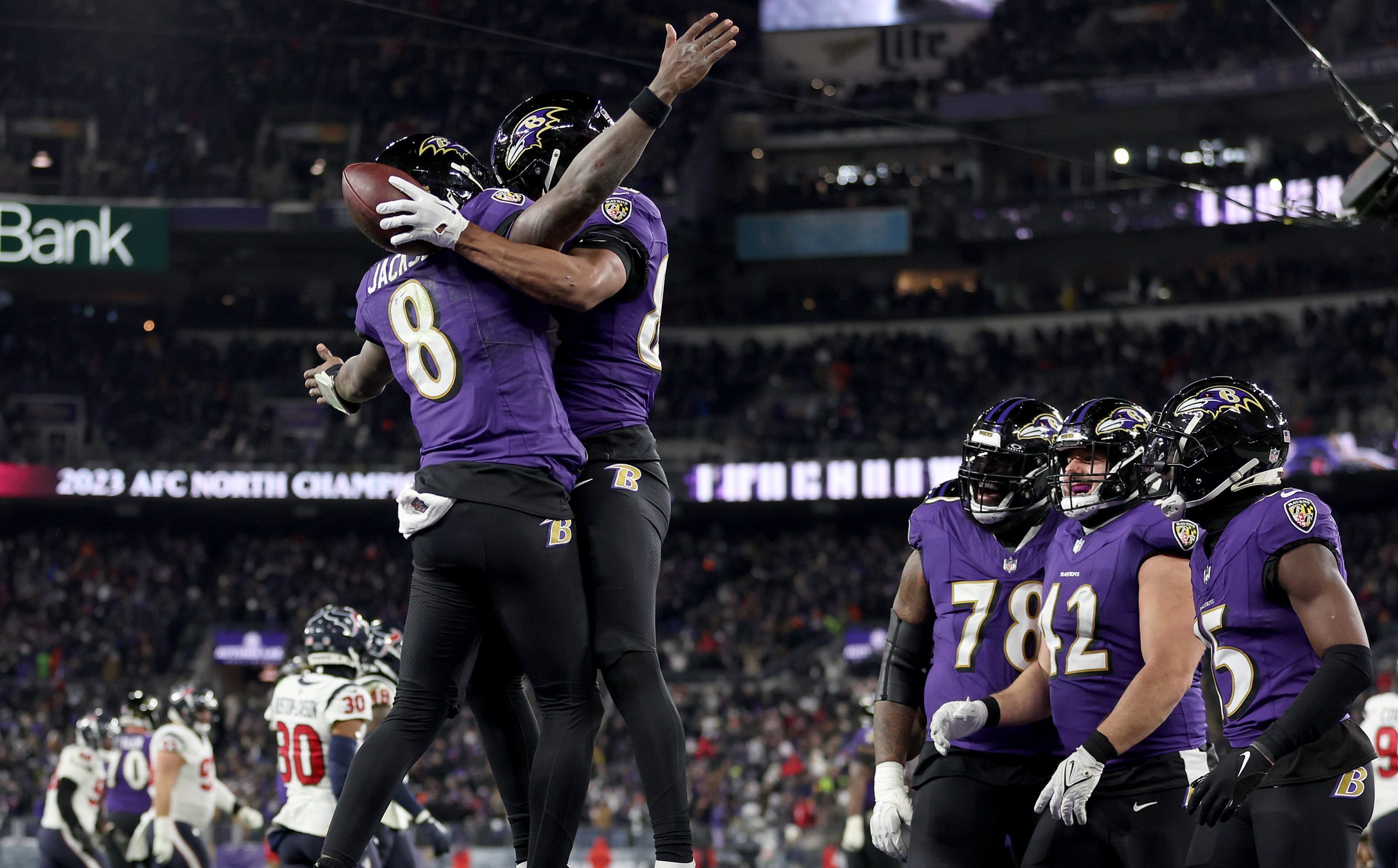 BALTIMORE, MARYLAND - JANUARY 20: Isaiah Likely #80 of the Baltimore Ravens celebrates with Lamar Jackson #8 after scoring a 15 yard touchdown against the Houston Texans during the fourth quarter in the AFC Divisional Playoff game at M&T Bank Stadium on January 20, 2024 in Baltimore, Maryland. (Photo by Patrick Smith/Getty Images)